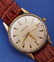 MOVADO HERRENARMBANDUHR, METALL, ROSE-G AUF- LAGE, BER., EDELST.-BOD. U. GLASRAND AUFGEDR., 2-FARB. VERSILB. BL., SCHWEIZ UM 1949, 17 ST., ...