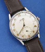 TISSOT HERRENARMBANDUHR, HAMMERAUTOMATIK, EDELST., BOD. GESCHR., SCHWEIZ UM 1950, 2-FAR- BIG VERSILB. BL., ALTERSBED. LT. FLECKIG, AUS- SER LEDERBD. ...