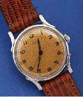 EBEL HERRENARMBANDUHR, SCHWEIZ UM 1946, EDELST., BOD. GESCHR., AUßER LEDERBD. ORIG. ZUST., BL. ALTERSBED. FARBL. GET., 17 ST., HANDAUFZUG, KAL. ...