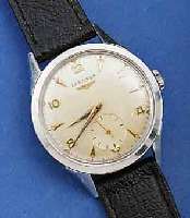LONGINES HERRENARMBANDUHR, EDELST., BOD. GE- SCHR., SCHWEIZ UM 1951, AUßER LEDERBD. ORIG. ZUST., 17 ST., HANDAUFZUG, KAL. 12,68Z, GEPR. CHATONS, ...
