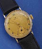 OMEGA HERRENGOLDUHR, SCHWEIZ UM 1937, GG 585/000, BOD. U. GLASRAND AUFGEDR., D. CA. 30 MM, 2-FARB. VERG. ORIG. BL. FLECKIG, BAND NEUTR. NEU, 15 ...