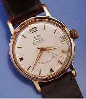 GLASHÜTTE HERRENARMBANDUHR AUTOMAT, DEUTSCH- LAND UM 1964, METALL ROSEVERG., EDELST.-BODEN GEDR., ZENTRALSEK., DATUM, 23 ST., ZENTRAL- ROTOR, KAL. ...