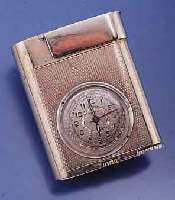 ETERNA WATCH CO/WEISCO BENZINFEUERZEUG MIT INTEGRIERTER UHR, SCHWEIZ UM 1950, METALL VERS., 17 ST. ANKERW., INCABL. STOßGES., ÜBERH. UNERL., ...