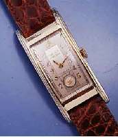 GRUEN CURVEX HERRENARMBANDUHR SERIE PRECISION, GG-FILLED, GEZOGENE RECT.-FORM IN SICH GE- W., MAßE CA. 45 X 20 MM, 2-FARB. VERS. BLATT, KL. SEK. ...