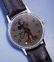 MICKEY MOUSE ARMBANDUHR, FRANKREICH UM 1970, MYSTER. SEK.-ANZ. DURCH POLARISIERENDE ZEIGER- SCHEIBE, METALL VERCHR., EDELST.-BODEN GE- SCHR., ...