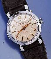 WESTCLOX ARMBANDWECKER, USA/DEUTSCHLAND UM 1950, METALL VERCHR., EDELSTAHLBOD. AUFGEDR., WECKZEIT EINSTELLB. DURCH DRÜCKER AUßEN 2, STOPP AUF ON ...