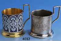2 Teeglashalter, 1 x Leningrad, 916er Silber vergoldet, um 1965, weiß und blau in Cloisonnetechnik emaill., H ca. 8 cm; 1 x Metall versilbert, ...