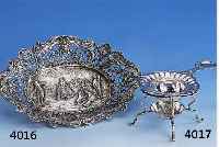 TEESIEB MIT HALTER, HANAU, SCHLEISSNER UM 1890/1900, 800ER SILBER, BAROCKSTIL, Z.T. NACHGESTOCHEN, FLORAL VERZIERT, ANFLUG AUF JAPONISMUS, H CA. ...