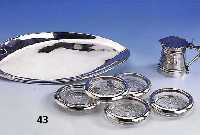 Konvolut, 925er Silber, best. aus: Anbietschale, Mexiko, ca. 31 x 15 cm; 5 Glasuntesetzer mit Silberrand, versch. Dekore, D. ca. 9.5 bzw. 10 cm