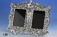 Doppelstandbilderrahmen, 925er Silber, reich verziert mit Putten und Blumen, halb- plastisch, rs. blauer Samt, ca. 34 x 27 cm, BildgrÖße: 10 x ...