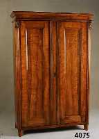 Kleiderschrank, deutsch, um 1850/60, Kirsch- baum massiv, zweitÜrig, Inlets vertieft, teil- restauriert, geriefte Lisenen mit Akantus- ...