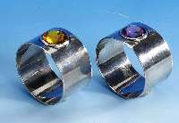 Paar Serviettenringe, 900er Silber, amethystfarb. und citrinfarb. facett. Glas- stein, D ca. 5.5 cm, massive Ausf.