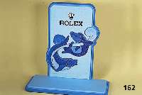 Schaufensterdekoration ROLEX, mit blauem Stoff in versch. Farbabstufungen und Mustern bezogen, Fischdekor, ca. 65 x 38 cm, Sockel 66 x 30 cm