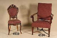 Stuhlsessel, deutsch, um 1925/30, Gestell z.T. Nußbaum massiv, Nußbaumfurnier, Beine- verstrebt, Armlehnen wuchtig in Veluten aus- laufend, ...