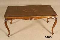 Couchtisch, Holland, um 1930, Korpus Weich- holz, Nußbaum massiv, Nußbaumfurnier, Zarge geschnitzt, Platte mit Bandintarsien und ...