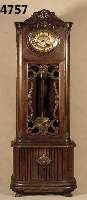 Standuhr, deutsch/Schwenningen, um 1900, Fa. Mauthe, Eiche massiv, Eichefurnier, viele geschwungene Schnitzereien, Giebel geschwungen mit ...