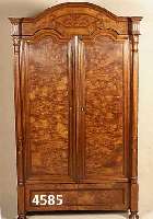 GrÜnderzeitschrank, deutsch, um 1890, Korpus Weichholz, Wurzelnußfurnier gespiegelt, dop- pelt bzw. dreifach getreppte Leisten, Kopfteil ...