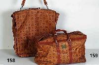 MCM-Kleidersack, typ. MCM-Dekor mit braunem Leder abgesetzt, Nr. 26518, 7 Kleider- bÜgel, ReißverschlÜsse, Schloß mit 2 SchlÜs- seln, min. ...
