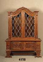 Vitrinenschrank, deutsch, wohl Aachen, um 1910 /20, Barockstil, Eiche massiv, Unterteil reich geschnitzt, mit KlauenfÜßen und FÜll- hornmotiven, ...
