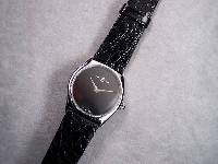 BAUME & MERCIER Armbanduhr, Schweiz wohl ungetr. Lagerw. um 1985, Edelst. pol., Mineralflachglas, Boden aufgedr., verg. Rundankerw., 17 St., ...