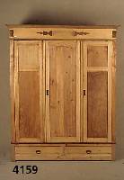 Kleiderschrank, wohl deutsch, um 1930, Weichholz, 3-tÜrig, zwei Sockelschubladen, aufgesetzte Schnitzereien, leichte AusfÜhrung, leicht ...
