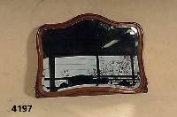Spiegel, deutsch, um 1900, Rahmen Eiche massiv, geschwungene Form, sparsame Schnitzer- ei, facettiertes Spiegelglas, ca. 75x105 cm