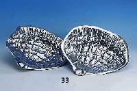 2 Austernteller, wohl Niederlande um 1910, Meistermarke WOW, Metall versilbert, Bes.- Monogr., feine Ausarbeitung, in Form von Muscheln, ...