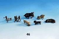 Konvolut 7 Wiener Bronzen, um 1900, best. aus: Schwein mit Kleeblatt, 2 Hunde (1 x besch.), 2 Negerjungen mit Elefant bzw. Hund, 1 Stier, 1 ...
