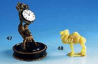 TaschenuhrstÄnder, um 1890, Grauguß, in Form eines turnenden Mannes, rÜcks. LÖtstellen, Sockel Holz schwarz und gold gelackt, mit Taschenuhr ...
