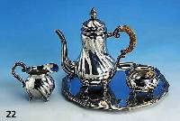 Moccaset, 835er Silber, bestehend aus, Kanne H. ca. 20 cm, Sahnegießer H. ca. 7 cm und Zuckerschale D. ca. 8 cm, goudroniert, dazu Tablett ...