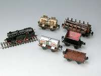 7 MÄrklin Spur 0 Wagen, 30er Jahre, 1 x Langholzwagen mit Bremserhaus, 2 Tankwagen, 2 Niederbordwagen, 1 Kohlewagen, Drehschemel- wagen, ...