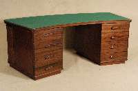 Schreibtisch, deutsch, um 1910, Rotholz massiv, wohl Designentwurf, Halbmondform, Schubladenkasten dekoriert mit ausgehÖhlten Kehlungen, ...