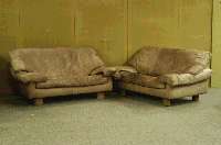 Designsitzgruppe, neuzeitlich, Lederbezug, aufwendig, starke Gebrauchsspuren, verfleckt, bestehend aus drei 2-sitzer Sofas und ein Sessel, ca. ...