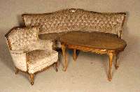 Sitzgruppe, deutsch, um 1964/72, bestehend aus Sofa, 3 Sessel, Ohrenbackensessel und Tisch, z.T. Nußbaum massiv, aufgesetzte Schnitzerei, RÜcken ...