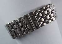 CHOPARD-Uhrenarmband, Stahl/GG 750/000, unsichtb. Faltschließe, L ca. 18 cm, Stegbrei- te ca. 17 mm, ehem. unverb. Preisempf. lt. Einl. EUR 1070.-