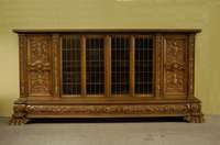 BÜcherschrank, deutsch, um 1960/65, Korpus Weichholz, Buche und Nußbaum massiv, Front mit reicher Bildhauerarbeit von allerbester QualitÄt, ...