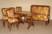 Salongarnitur bestehend aus Tisch, 2-sitzer Sofa und 4 StÜhle, deutsch, um 1880/90, z.T. Nußbaum massiv, von bester QualitÄt, eklektizistisch, ...