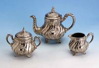 Kaffeeservice, WMF um 1895, Legierung I/0, best. aus: Kaffeekanne (H. ca. 20 cm), Zucker- dose und Sahnegießer, Barockstil, Monogrammfeld frei ...