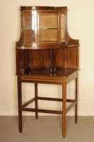 Eckvitrine, deutsch, um 1900, dreigeschossig , mit halbrundem verglastem Aufsatz mit Tischsockel, Edwardienstil, Palisander mit doppelten hellen ...