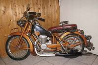 Kinder- oder Modellmotorrad, bez. Lenaerts, 40er/50er Jahre, Blech, orange-braune Lackierung, l.Alterssch., l.rest., Ledersitz rot u.schwarz, ...