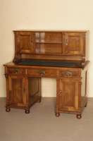 Schreibtisch, deutsch, um 1880, GrÜnderzeit, Korpus Weichholz, Nußbaumfurnier, auf KugelfÜßen, Lisenen gerillt, TÜrfÜllungen furniert mit ...