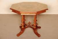 Salontisch, deutsch, um 1880/90, 4 in sich verschrÄnkte AuslegerfÜße, in reicher Drechselarbeit, Buche und Nußbaum massiv, Platte 6-eckig, ...