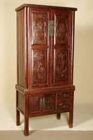 Schrank, Asien, um 1900, Obstholz massiv, rötlich gebeizt, 2-teiliger Korpus, Unterteil auf eckigen Hochbeinen, zwei Türen und zwei Schubladen, ...