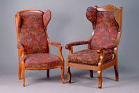 Ohrenbackensessel, südd., um 1870/80, Buche mass., kirschbaumfarb., sparsame Zierriefung, allseitig geschweift, Bezug später, alt belassen, ...