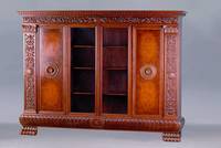 Bücherschrank, deutsch, 20/30er Jahre, Korpus WH/HH, Nußbaum massiv, Bildhauerarbeiten a.d. Vollholz im Renaissancestil m. Anspielung auf Fülle u. ...
