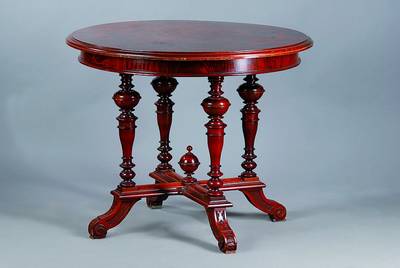 Salontisch, Gründerzeit, um 1880, Nußbaum/ Wurzelnußfurnier, kleinere Fehlstellen, reich gedrechselt, Gebr.-Sp., H. 74 cm, D. 89 cm