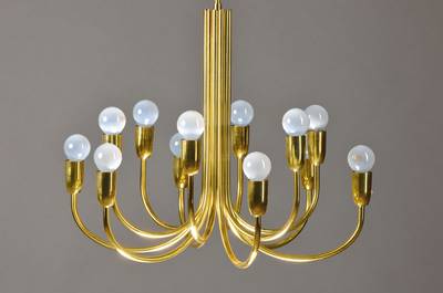 Designerlampe, deutsch, um 1965/75, Messing, 12 Brenstellen, diese in Sechsersätzen gestuft angeordnet, Funktion nicht geprüft, H.ca. 95cm, D.ca. ...