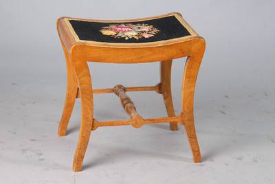 Hocker, deutsch, um 1820-30, Biedermeier, Nußbaum, Bezug bestickt, fein gedrechselter Steg, lt. in sich gebogte Form, ca. 44x46x35 cm