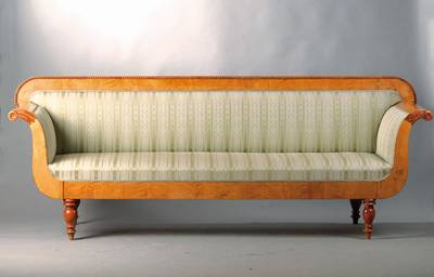 Biedermeiersofa, um 1835/40, Birke furniert, Rücken mit Perlleistenverzierung, Armlehnen in stilüblichem Füllhorndekor, Balusterfüße sek., Bezug ...