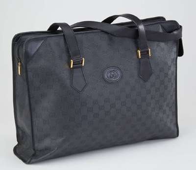 GUCCI Aktentasche, schwarzes Canvas mit Gucci Label Stickerei, 2 Tragehenkel aus schwarzem Leder, innen schwarz beschichtet, ca. 42 x 30 x 9 cm, ...